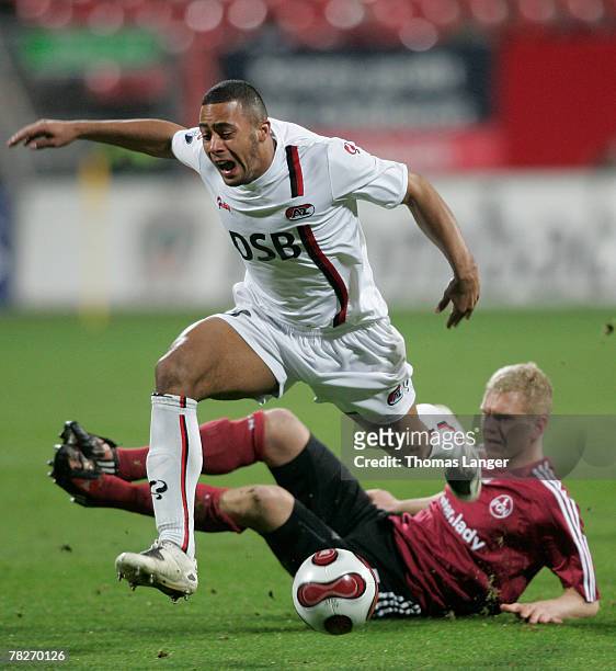 Andreas Wolf of Nuremberg and Moussa Dembele of Alkmaar battle for the ball during the UEFA Cup group A match between 1. FC Nuremberg and AZ Alkmaar...
