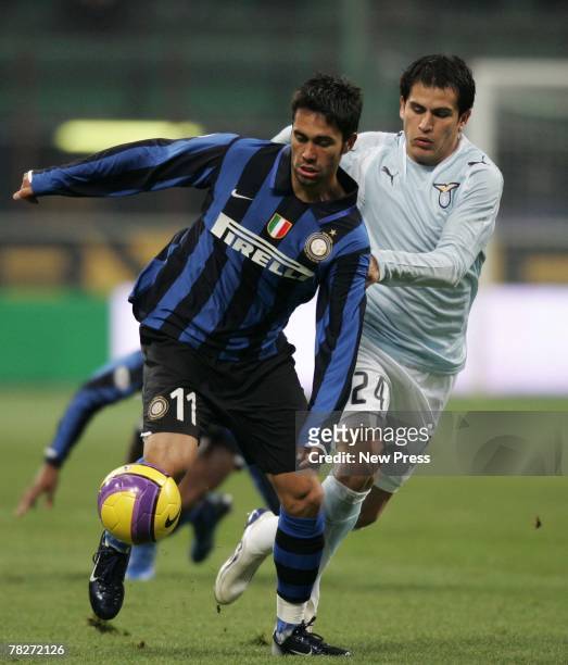 Luis Jimenez of Internazionale and Cristian Ledesma of Lazio in action during the Serie A match between Inter Milan and Lazio held at the San Siro...