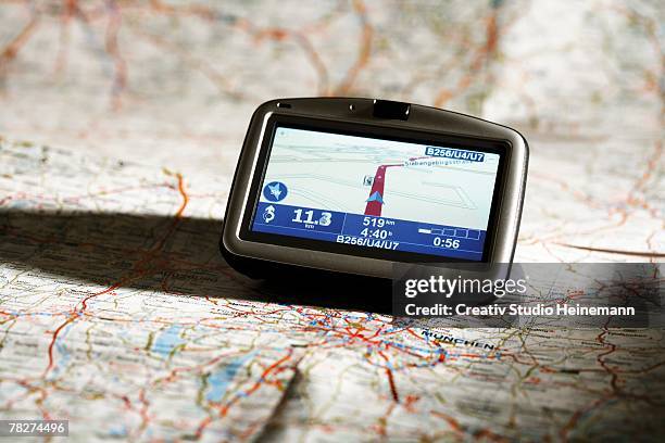 navigation instrument on map, close-up - global positioning system stock pictures, royalty-free photos & images