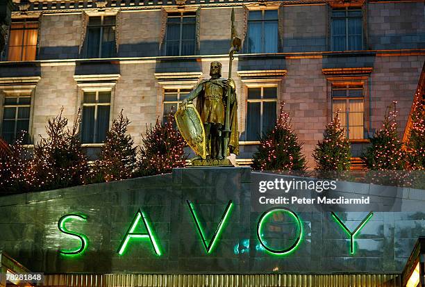 The Savoy hotel name is lit in green neon at the front entrance on December 6, 2007 in London. Some of the fixtures and fittings are to be auctioned...