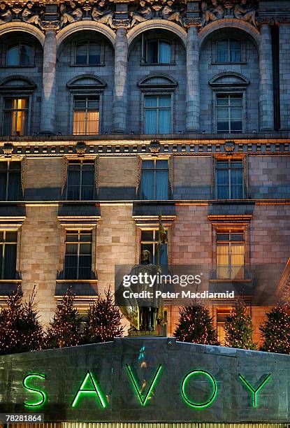 The Savoy hotel name is lit in green neon at the front entrance on December 6, 2007 in London. Some of the fixtures and fittings are to be auctioned...