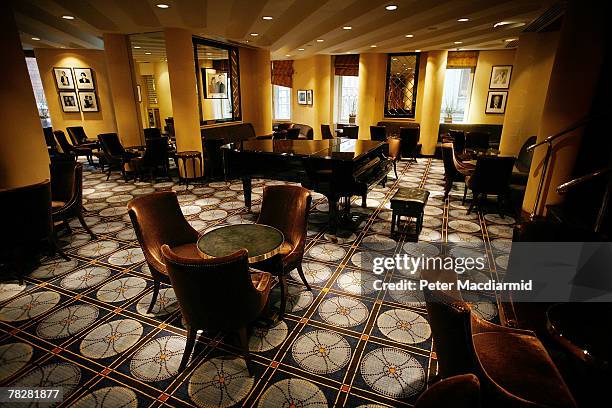 Chairs and tables line the American Bar at the Savoy Hotel on December 6, 2007 in London. Some of the fixtures and fittings are to be auctioned...