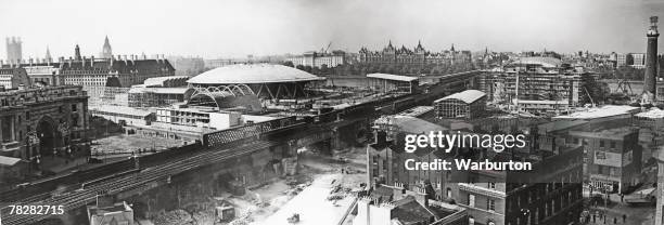 The construction of the Festival of Britain site on London's South Bank, October 1950. Waterloo Station is on the left, with County Hall behind it,...