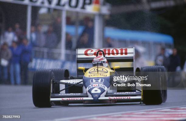 Brazilian racing driver Nelson Piquet drives the Canon Williams Team Williams FW11B Honda V6t in the 1987 Belgian Grand Prix at Circuit de...