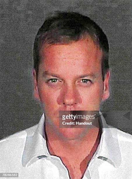 In this handout photo provided by the Glendale City Police Department , actor Kiefer Sutherland poses for his mugshot photo at Glendale City Jail...