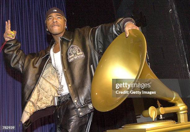 Singer Sisqo flashes the peace sign after being nominated for a Grammy Award at the 43rd annual Grammy nominations press conference January 3, 2001...