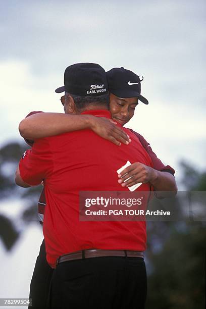 Tiger Woods hugs his father Earl Woods at the 1999 TPC