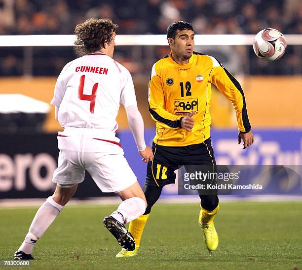 Abdul Wahab Abu Al Hail of Sepahan and Matt Cunneen of Waitakere United battle for the ball during the FIFA Club World Cup Japan 2007 opening match...