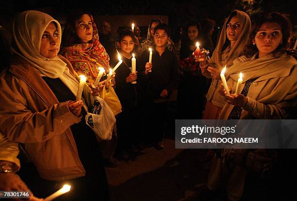 Supporters of deposed judge Iftikhar Muhammad Chaudhry hold lit candles after police stopped a march outside his residence during a protest for the...