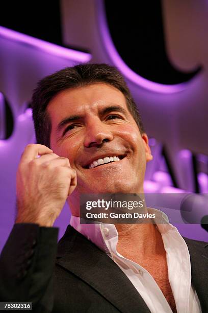 Simon Cowell presents Elizabeth Murdoch with Businesswoman of the year at the 'Five' Women in Film and Television Awards at the Hilton Hotelon...