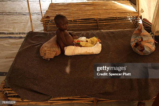 Bishara Ibraheim waits on a bed with an infected and broken leg inside of a clinic partly operated by Doctors Without Borders December 7, 2007 in...