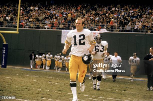 Quarterback Terry Bradshaw of the Pittsburgh Steelers runs onto the field for the second half during an NFL game against the San Diego Chargers at...