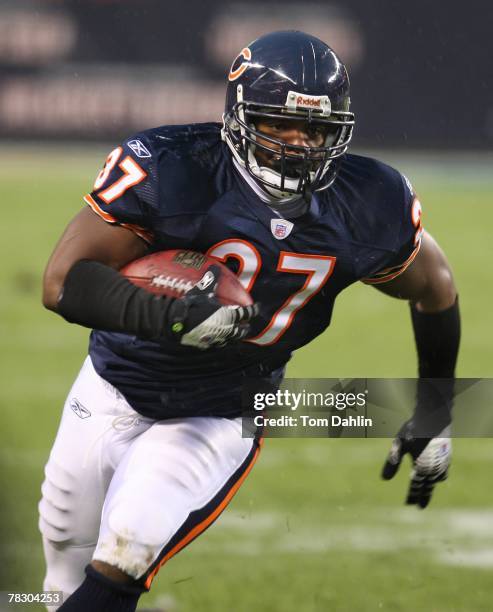 Jason McKie of the Chicago Bears carries the ball during an NFL game against the Denver Broncos at Soldier Field on November 25, 2007 in Chicago,...