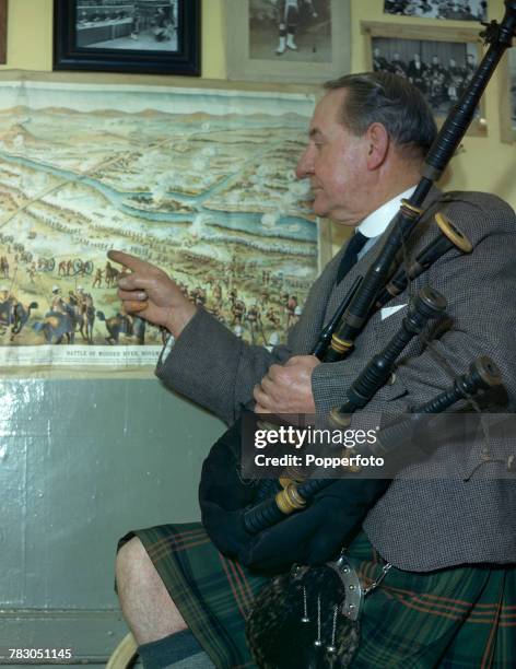 Scottish bagpipe player Willie Ross , principal instructor at the Army School of Bagpipe Music and Highland Drumming, pictured with his bagpipes as...