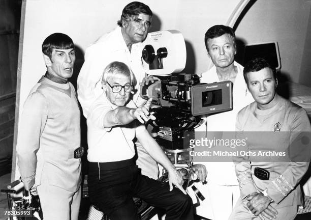 Actors Leonard Nimoy, DeForest Kelley and William Shatner pose for a portrait with writer Gene Roddenberry and director Robert Wise during the...