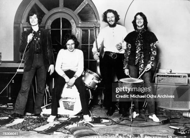 Rock band "Blind Faith" pose for a portrait in 1969. : Steve Winwood, Ric Grech, Ginger Baker, Eric Clapton. Photo by Bob Seidemann.