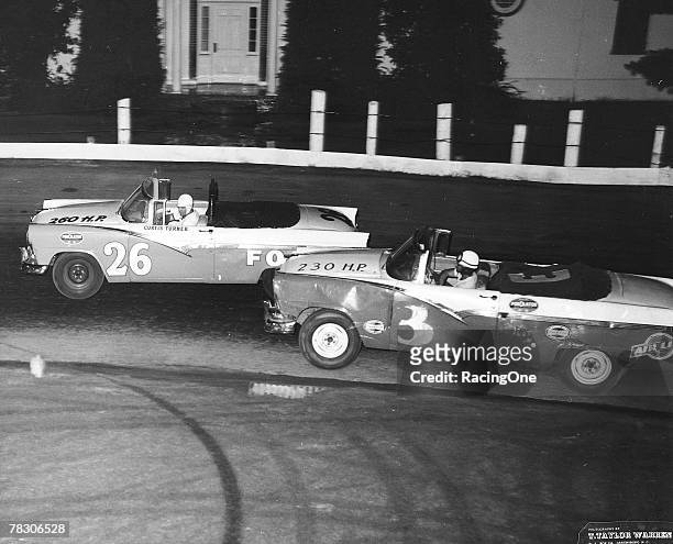 Curtis Turner was known as an aggressive driver who refused to give even an inch during a race. Here Turner tangles with Normal Schihl , both driving...