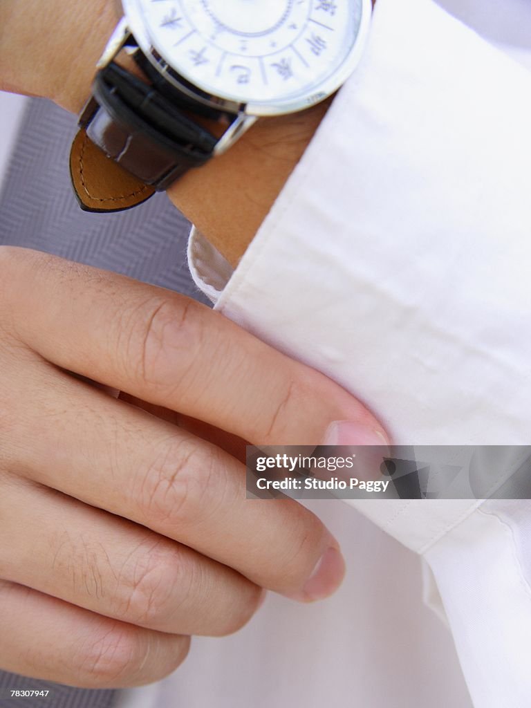 Close-up of a Chinese wristwatch on a person's hand