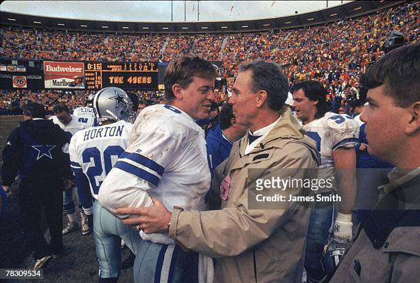 Quarterback Troy Aikman of the Dallas Cowboys talks to Roger Staubach after winning against the San Francisco 49ers in the 1992 NFC Championship Game...