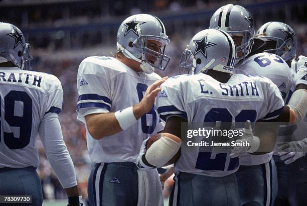 Running back Emmitt Smith of the Dallas Cowboys is congratulated by quarterback Troy Aikman after scoring a touchdown against the San Francisco 49ers...