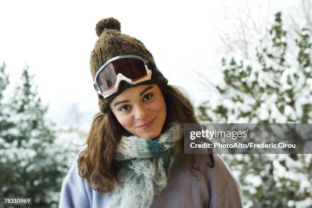 young woman dressed in ski clothing, smiling at camera, portrait - ski goggles stock pictures, royalty-free photos & images