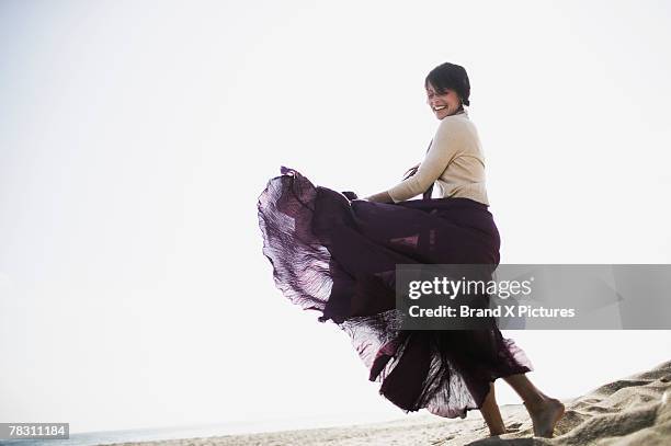 woman wearing skirt - skirt stock pictures, royalty-free photos & images