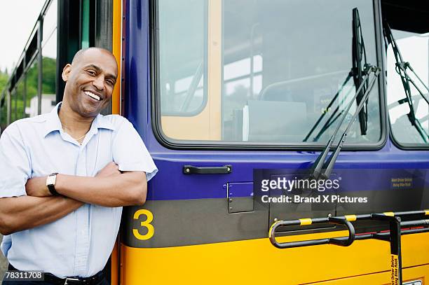 bus driver by bus - bus driver stock pictures, royalty-free photos & images
