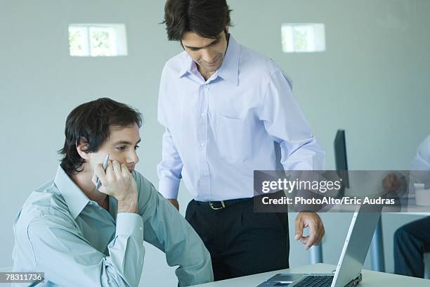 Helping Someone On Computer On White Photos and Premium High Res ...