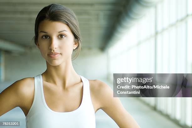 teenage girl looking at camera, wearing tank top, portrait - girl in tank top stock-fotos und bilder