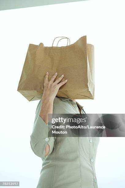 Woman Holding Paper Bag On Shoulder Head Hidden, 照片檔