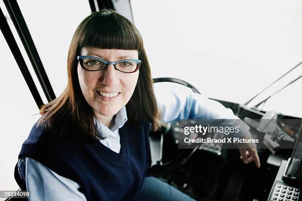 bus driver at steering wheel - autista di autobus foto e immagini stock