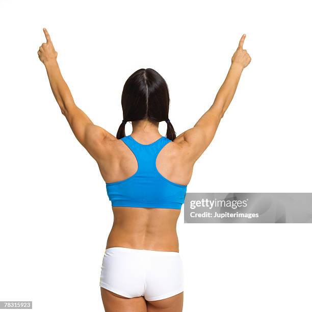 back of woman with arms raised - tank top back stock pictures, royalty-free photos & images