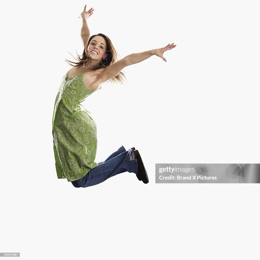 Woman leaping into air