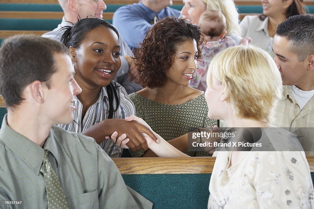 Congregation greeting each other in church