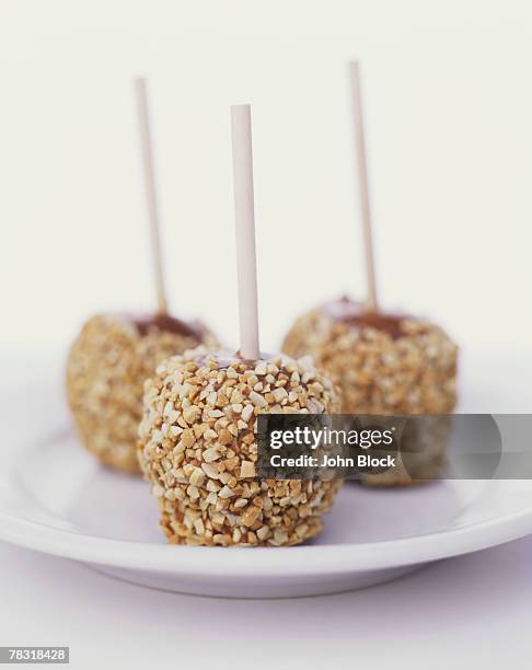 caramel apples - caramel block stock pictures, royalty-free photos & images