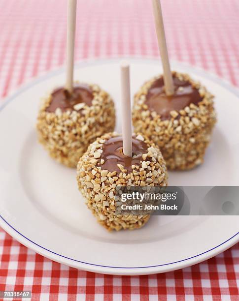 caramel apples - caramel block stock pictures, royalty-free photos & images