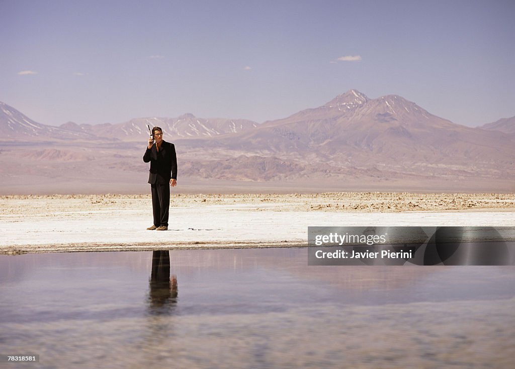 Businessman isolated in salt flat