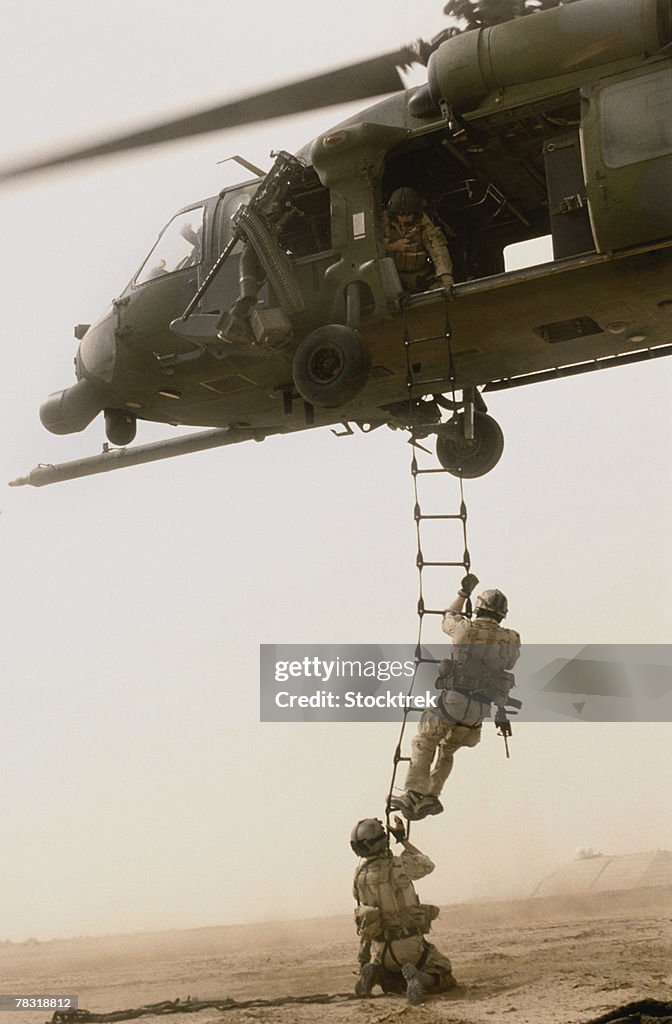 Helicopter Using Ladder Soldiers Climbing Ladder Hanging From Helicopter High-Res Stock Photo ...