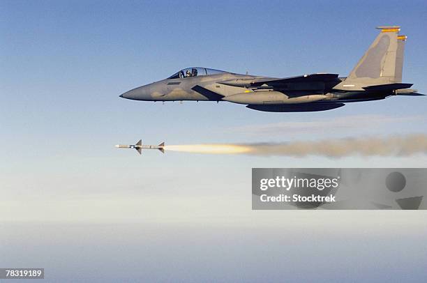 f-15 eagle firing aim-7 sparrow missile - rocket landing stock pictures, royalty-free photos & images