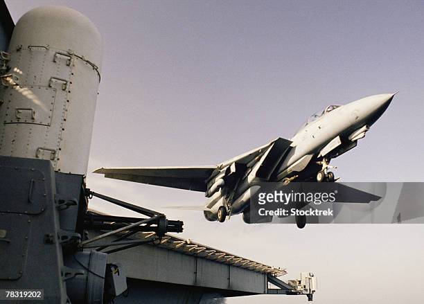 f-14b tomcat taking off from aircraft carrier - f 14 tomcat stock pictures, royalty-free photos & images