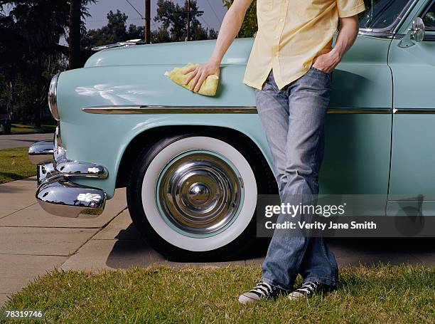 man polishing vintage car - washcloth stock-fotos und bilder