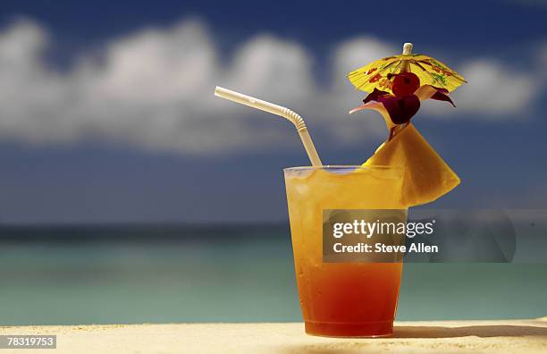 tropical drink - cocktail umbrella stock pictures, royalty-free photos & images