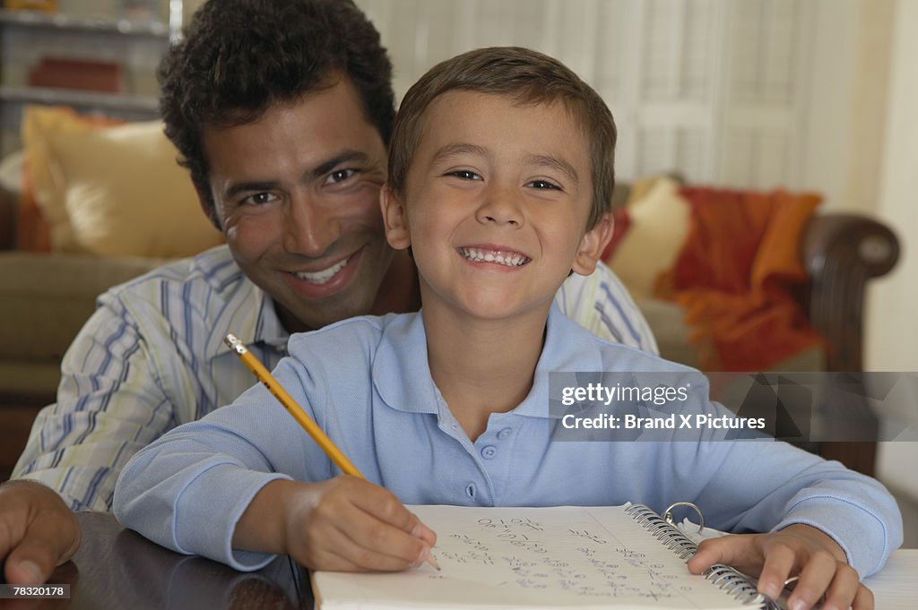 Dad and son doing homework