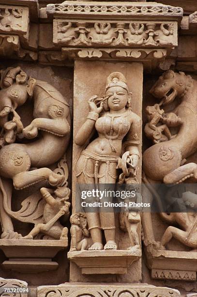 haute relief of nymph, paraswa nath temple, khajuraho, india - khajuraho statues stock pictures, royalty-free photos & images