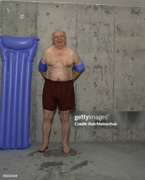 man with floaties - chubby swimsuit stock pictures, royalty-free photos & images