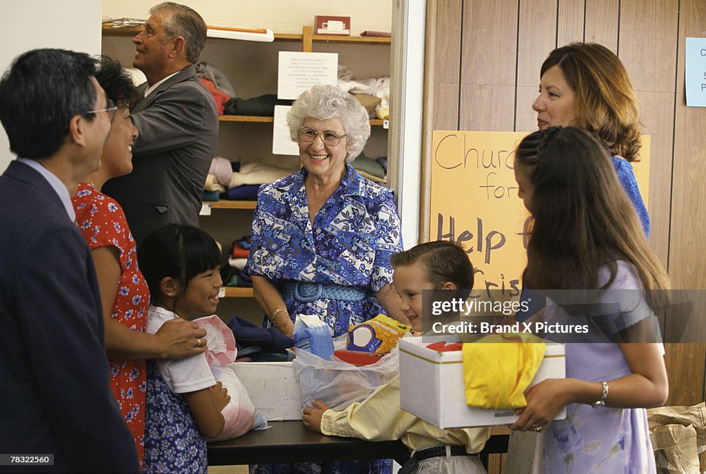 Volunteers at church giving donations