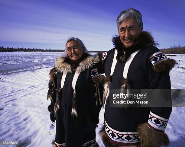 eskimos in traditional clothing - inuit people stock-fotos und bilder