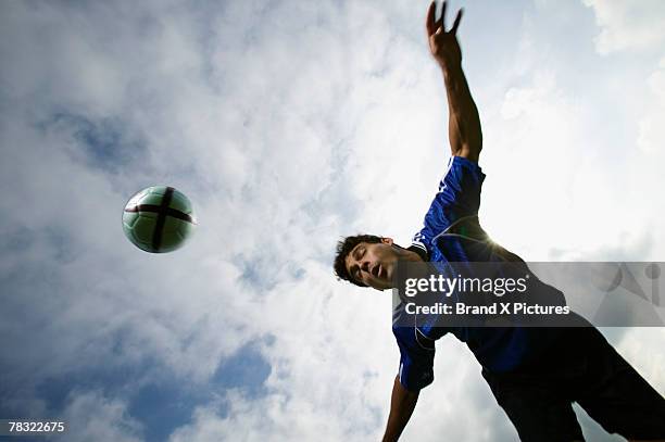 man head butting soccer ball - mit dem kopf stoßen stock-fotos und bilder