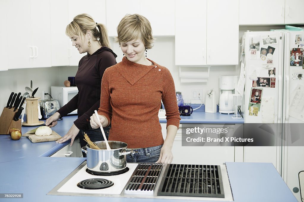 Women cooking in kitchen