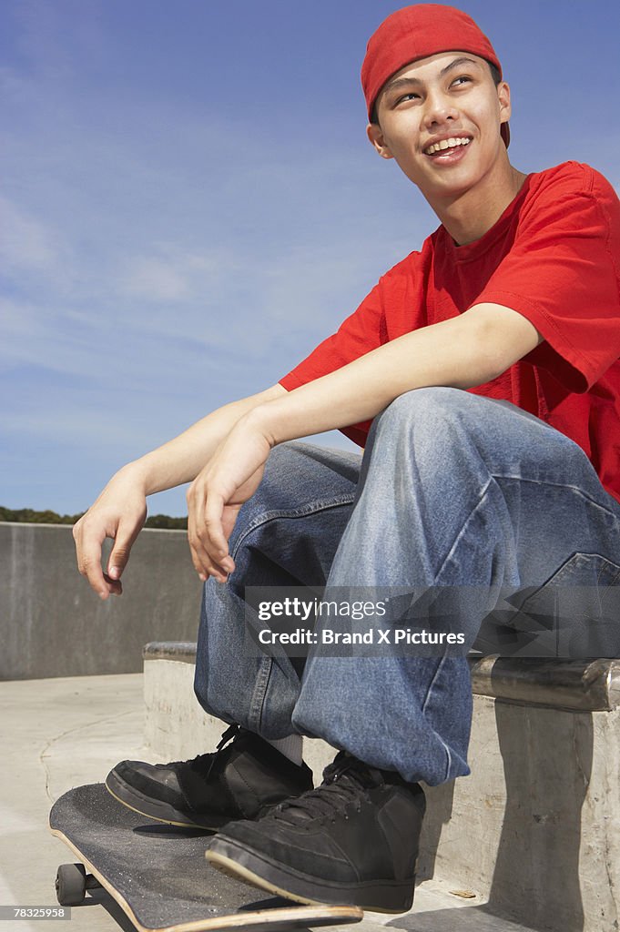 Teenage boy with skateboard